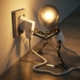 A cartoonized light bulb is pulling itself out of the socket to demonstrate the problems with energy usage and efficiency.